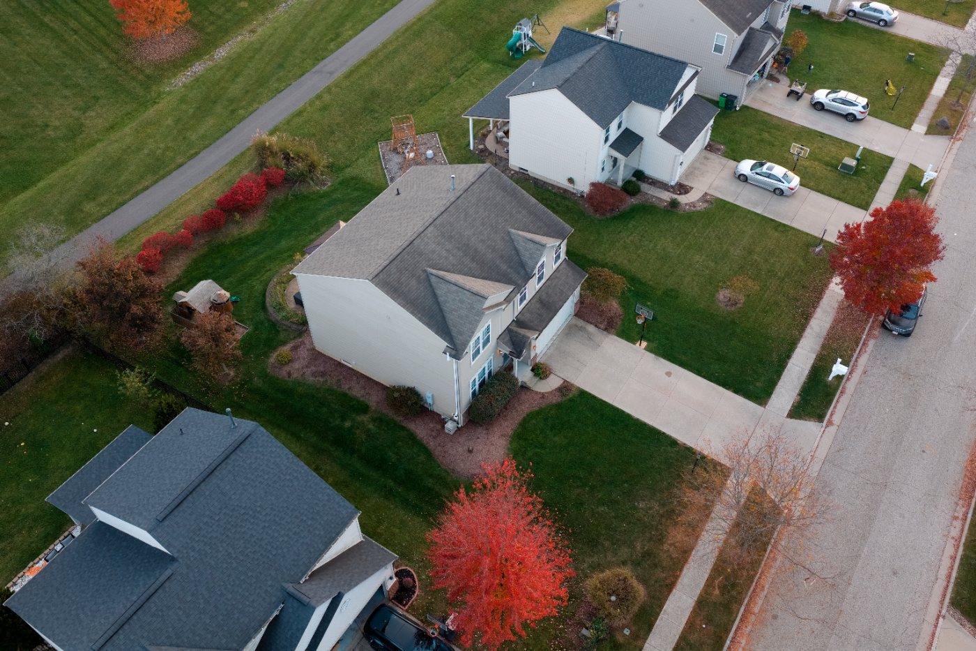 Straight-down view of the lot showing the house, back patio with gazebo, play area and neighboring lots